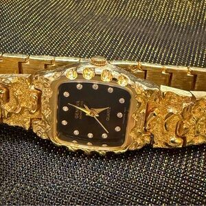 Woman’s Vintage Geneva 18k Gold plated Quartz Watch with Black Face.